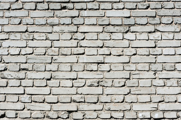 Old realistic brick wall made of white brick. White uneven brickwork.