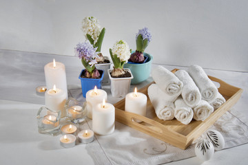 the Tray with hand towels, hyacinths in pots in the bathroom of the spa salon