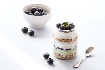 Serving of Yogurt with Whole Fresh Blueberries Oatmeal and Matcha Powder Healthy Diet Food Breakfast