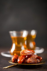 Dried dates and tea in the glasses