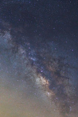 Starry night sky, Milky way galaxy with stars and space dust in the universe, Long exposure photograph, with grain.