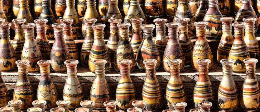 Bedouin stall with sand painting in bottles with layered coloured sand in the rock town and necropolis of Petra