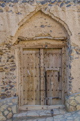 Fototapeta na wymiar Ancient door with ornaments in Oman