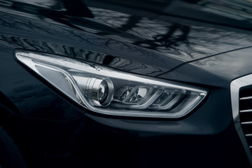 headlight of prestigious car close up