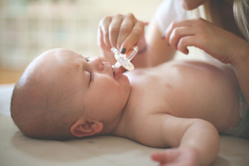 Mother with her crying baby boy.