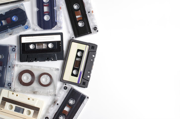 Old audio cassettes on white background. Flat top view
