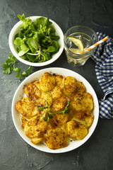 Homemade potato gratin with cheese and herbs