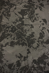 Dark grey concrete textured painted vertical background