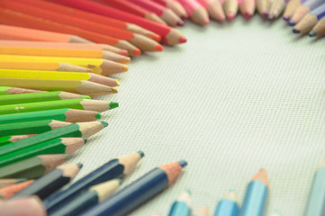 Fototapeta premium wooden colored pencils on white texture