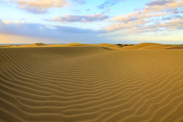 Rippled and smooth sand of dunes of Maspalomas in Gran Canaria.