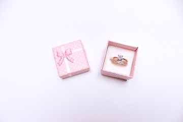 Gift box, pink box with a bow. Wedding ring