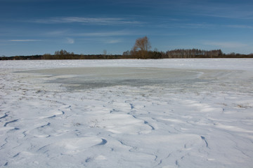 Frozen water and snow on the field