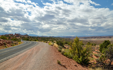 Fototapeta na wymiar Salt Valley and surrounding mountains panorama from Devils Garden road Arches National Park, Moab, Utah