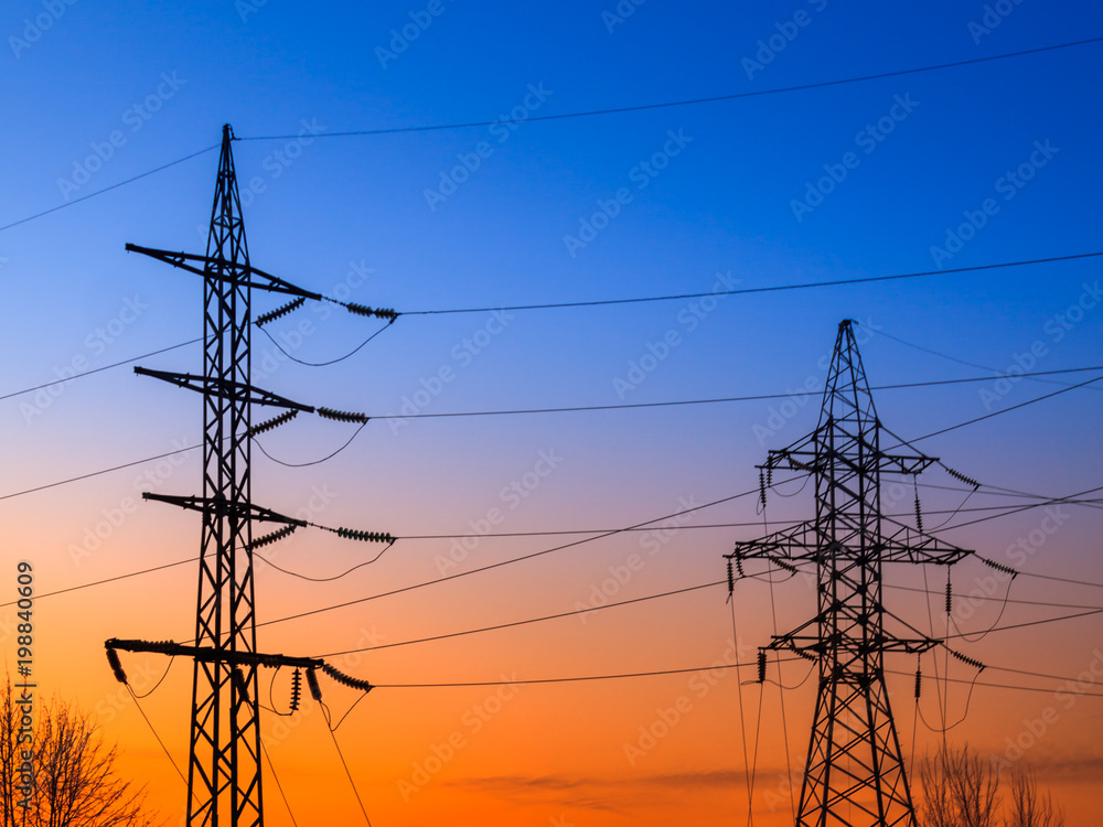 Wall mural Image of high voltage power line and sky. High-voltage power lines at sunset. Electric transmission towers.