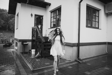 young woman running in the rain without umbrella