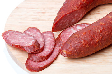 Sliced sausage on a kitchen board
