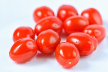 Cherry tomatoes stack isolated on white background