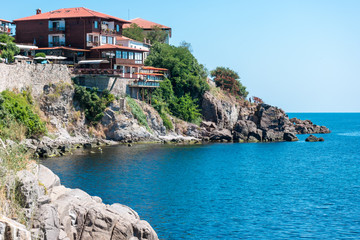 Houses, buildings and remains of the old fortress wall of the ancient seaside town of Sozopol. Bulgaria.