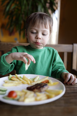 Child eating french fries