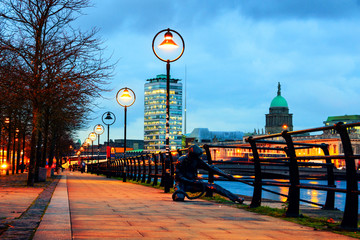 Illuminated Sean O'Casey Bridge with the Custom House in Dublin, Ireland