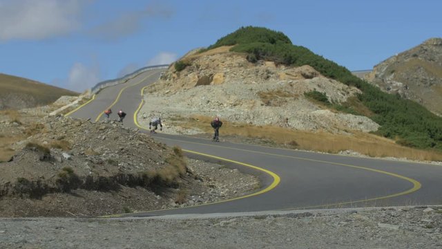 Men longboarding on Transalpina