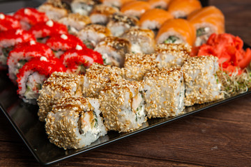 Best Types of Sushi Rolls. Philadelphia Roll, California Roll, Eel Avocado Roll. Delicious rolls and sushi with eel, salmon, shrimp, cucumber and philadelphia. Various delicious Types of Sushi Rolls