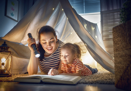 Mom and child reading a book