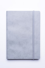 Grey leather notebook on white background
