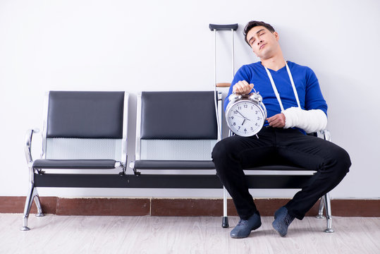 Desperate man waiting for his appointment in hospital with broke