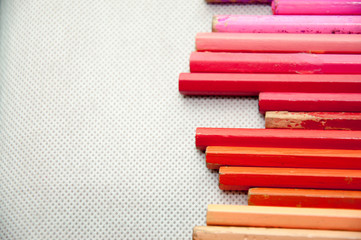 wooden colored pencils on white texture