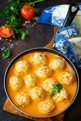 Meat balls turkey in tomato sauce in a frying pan, home cooking.