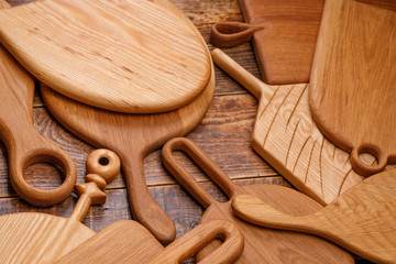 Design boards made of solid wood.Set of cutting boards on wooden background.