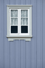 Window of an old traditional wooden house.