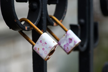 Lockers symbolizing love forever on the fence. Close-up.