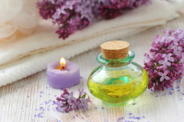 Obraz na płótnie Canvas SPA setting. Essential aroma oil with lilac