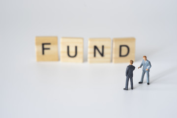 Businessmen talking about fund investing.