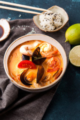 Japanese tom-yam soup with seafood and rice, chopsticks and lime - 198852475