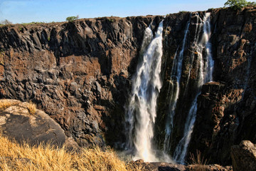 Fototapeta na wymiar Water flows, Victoria falls, Zambia