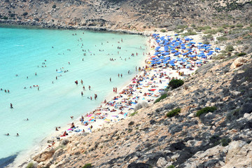 Obraz premium Lampedusa, Italy - August/25/2010 : tourists in rabbit island beach