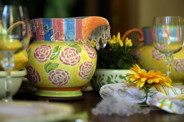 Close-up of decorated for special event table with colorful crockery dish