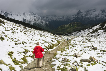 Obraz premium Senior Hiker With Red Coat, Austria
