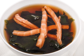 a plate of soup on a white background