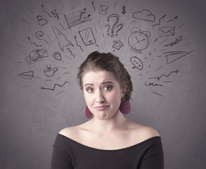 A dark brown haired pretty teenage girl with thoughts in her head illustrated by question mark, rocket, money, coffee, clock, email, social life icons drawn on the background wall concept.