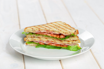 Club sandwich on wooden table