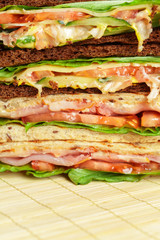 Club sandwich on wooden table