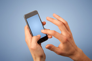 Female fingers touching blank smartphone