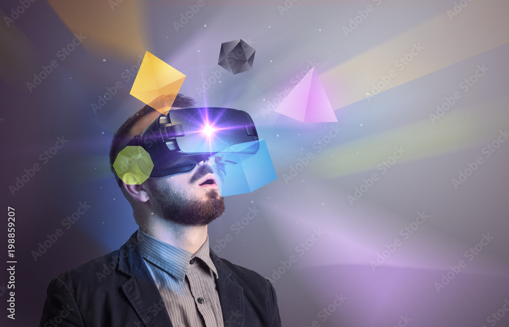 Poster amazed businessman with virtual reality colorful geometric shapes in front of him