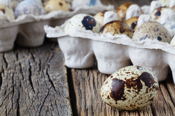 Organic quail eggs on rustic wooden table