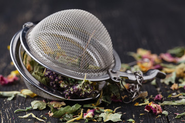 Heap of medicinal herbs for tea on wooden table