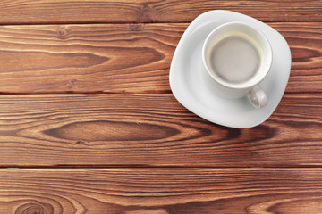 Coffee cup top view on old wooden